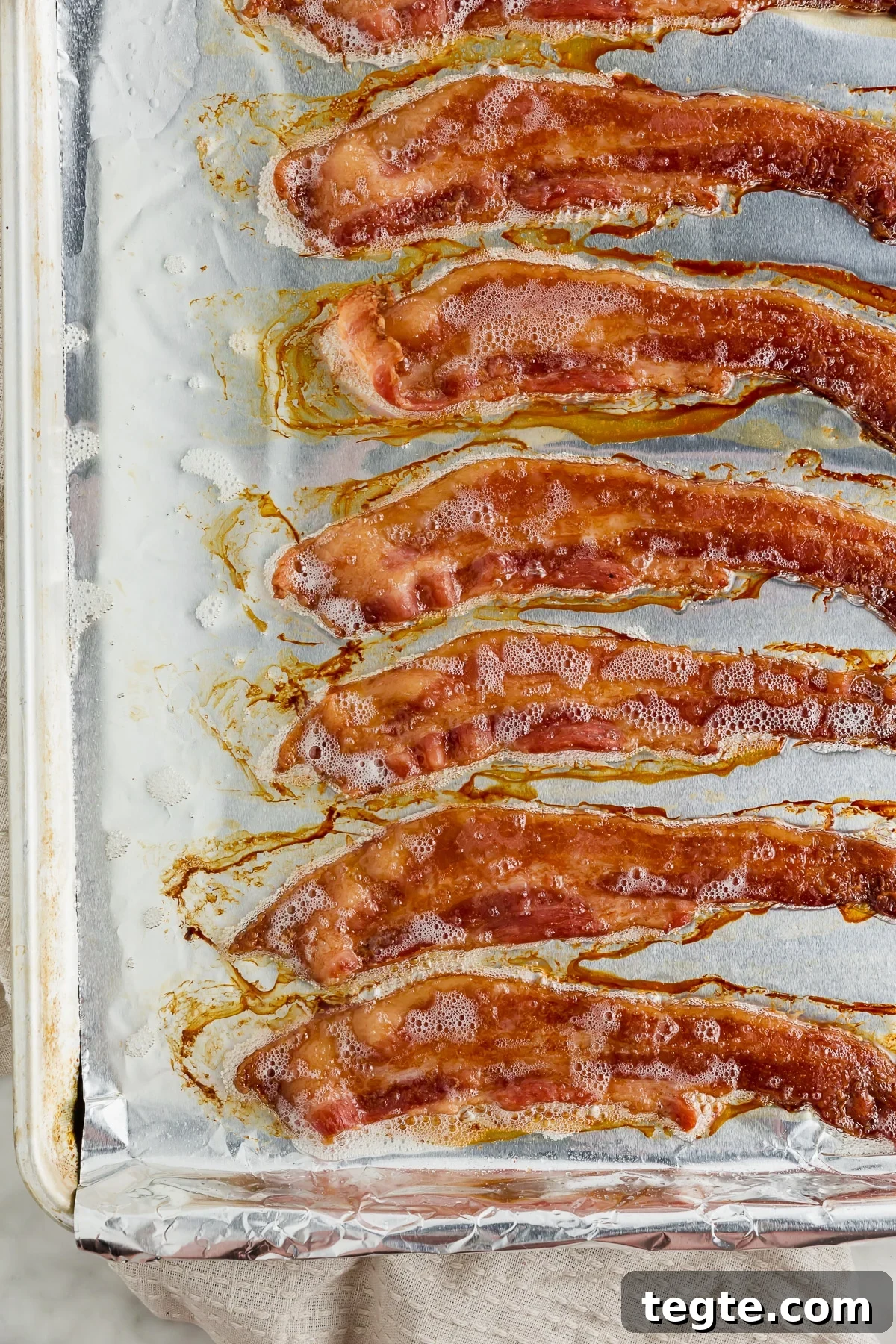 Crispy Oven-Baked Bacon: Foolproof Method for Perfect Slices 4 A baking sheet with cooked bacon straight from the oven.