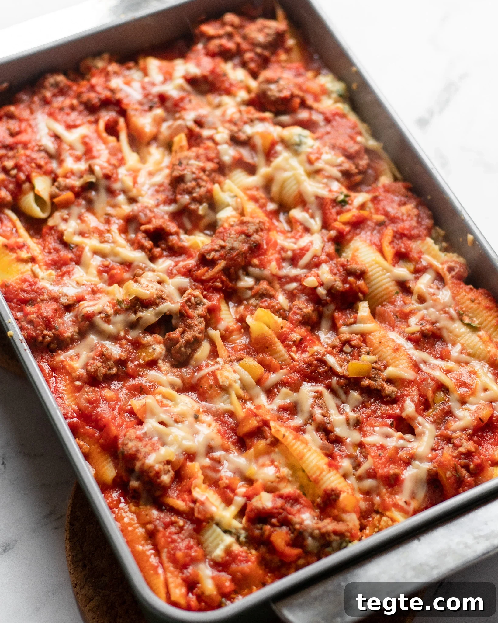 26 Cozy Vegan Dinners to Warm Your Winter Nights 16 overhead view of a large pan of cooked meaty vegan stuffed shells