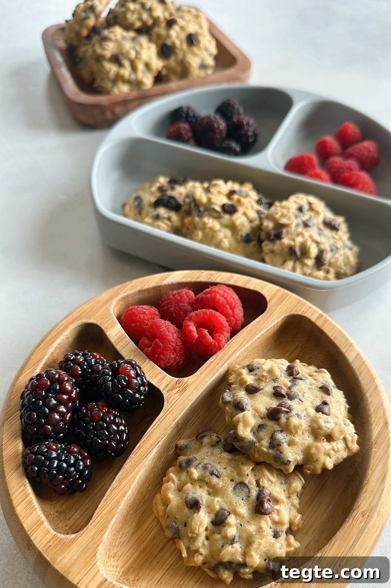 Chewy Maple Oatmeal Cookies with Warm Spices 2 Maple oatmeal cookies served with berries.
