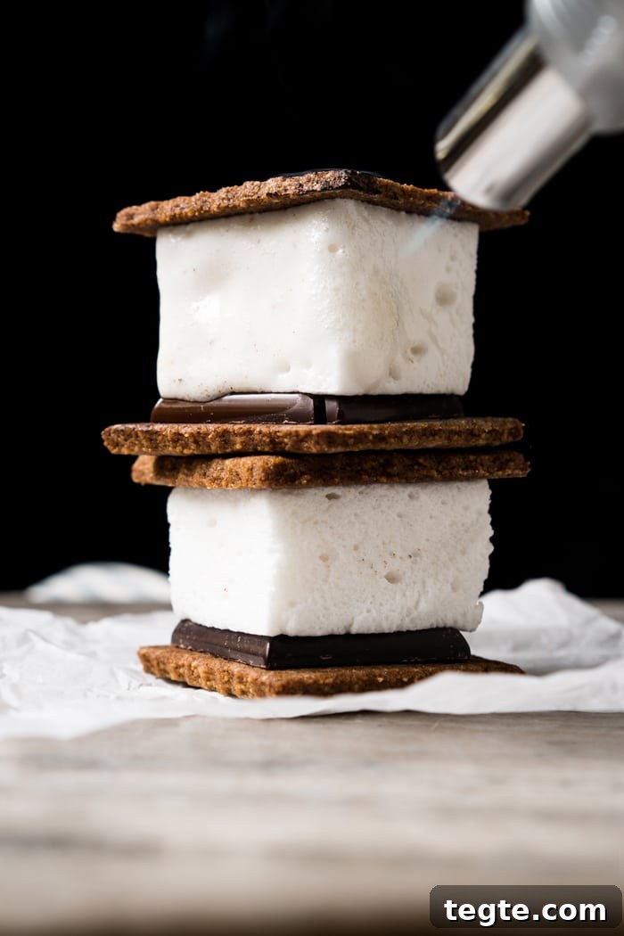 Keto S'mores Recipe: Low-Carb Campfire Treat recipe 2 Melting a keto s'more with a torch