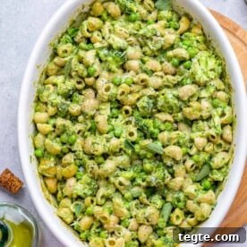 Over 20 St. Patrick’s Day Recipes for Festive Celebrations 16 green mac and cheese in a white dish