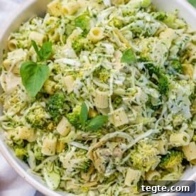 Over 20 St. Patrick’s Day Recipes for Festive Celebrations 17 green pasta salad with green veggies in a round white bowl.