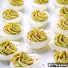 Over 20 St. Patrick’s Day Recipes for Festive Celebrations 21 avocado deviled eggs lined on a sheet pan