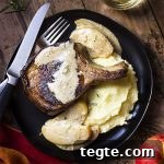 This simple stove top meal of pork chops pan seared in a cast iron skillet and served with an apple cream sauce is a perfect date night dinner!