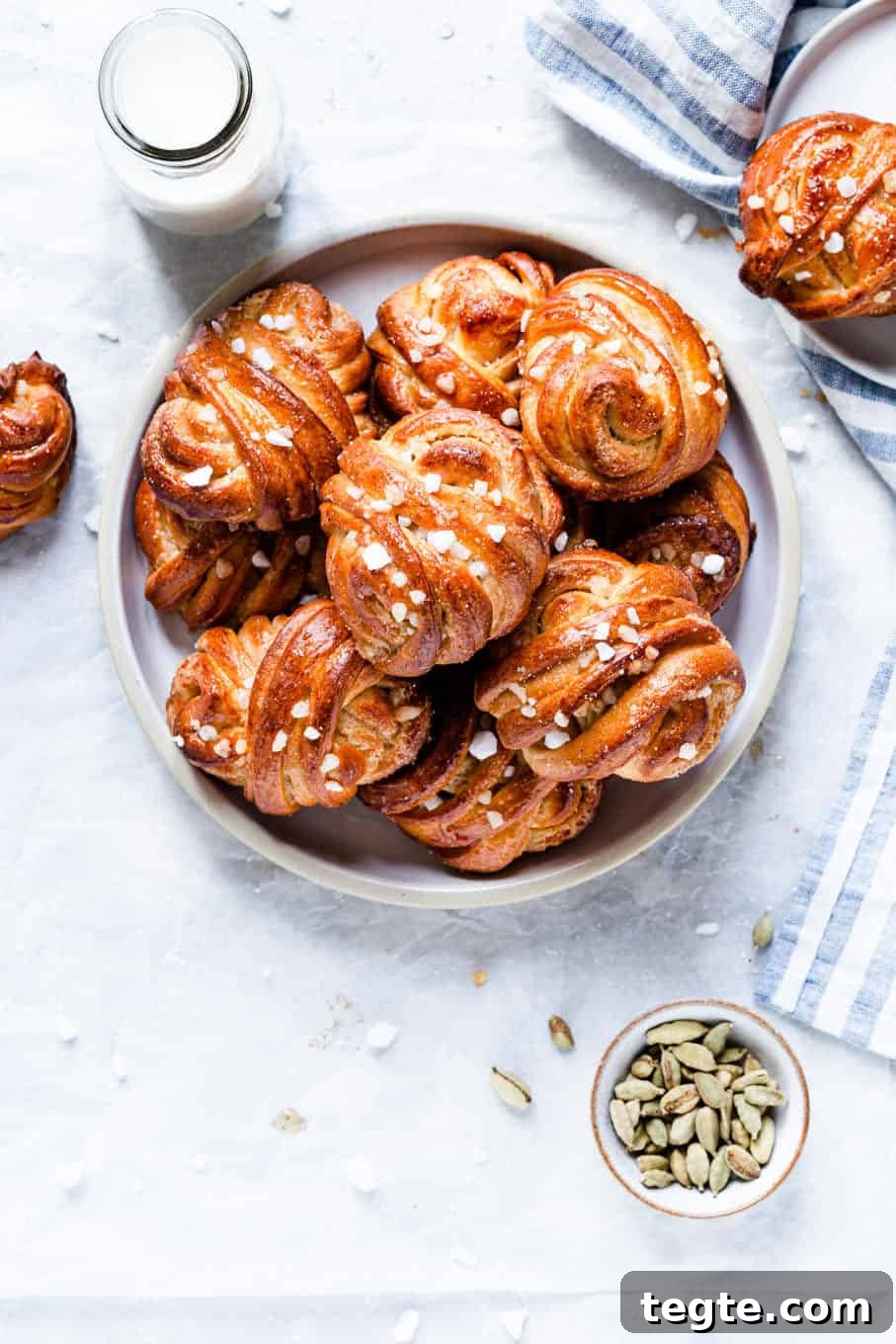 Authentic Swedish Cardamom Buns (Kardemummabullar) Recipe 2 overhead shot of a plate with golden cardamom buns