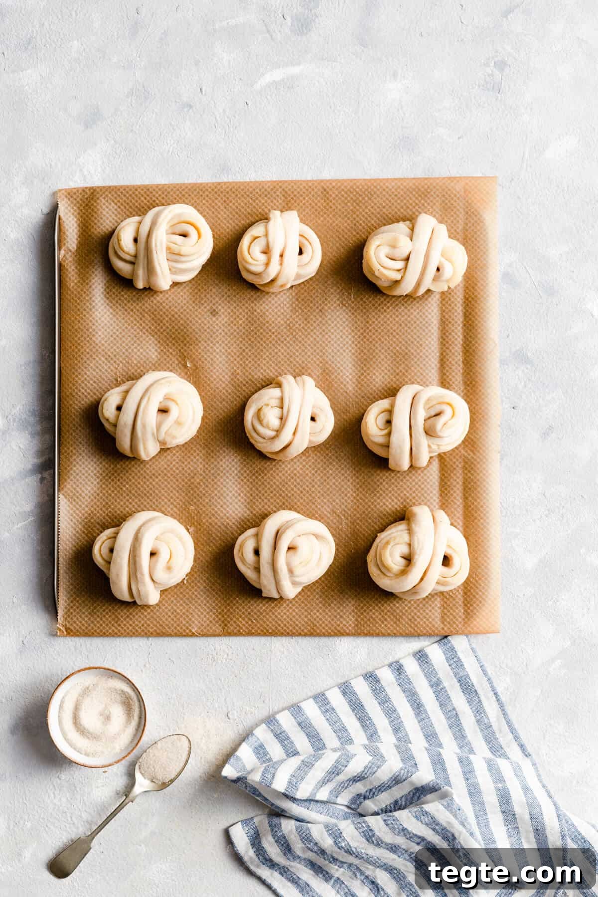 Authentic Swedish Cardamom Buns (Kardemummabullar) Recipe 17 top view of unbaked cardamom buns on baking tray