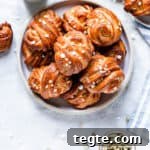 Authentic Swedish Cardamom Buns (Kardemummabullar) Recipe 20 overhead shot of a plate with golden cardamom buns