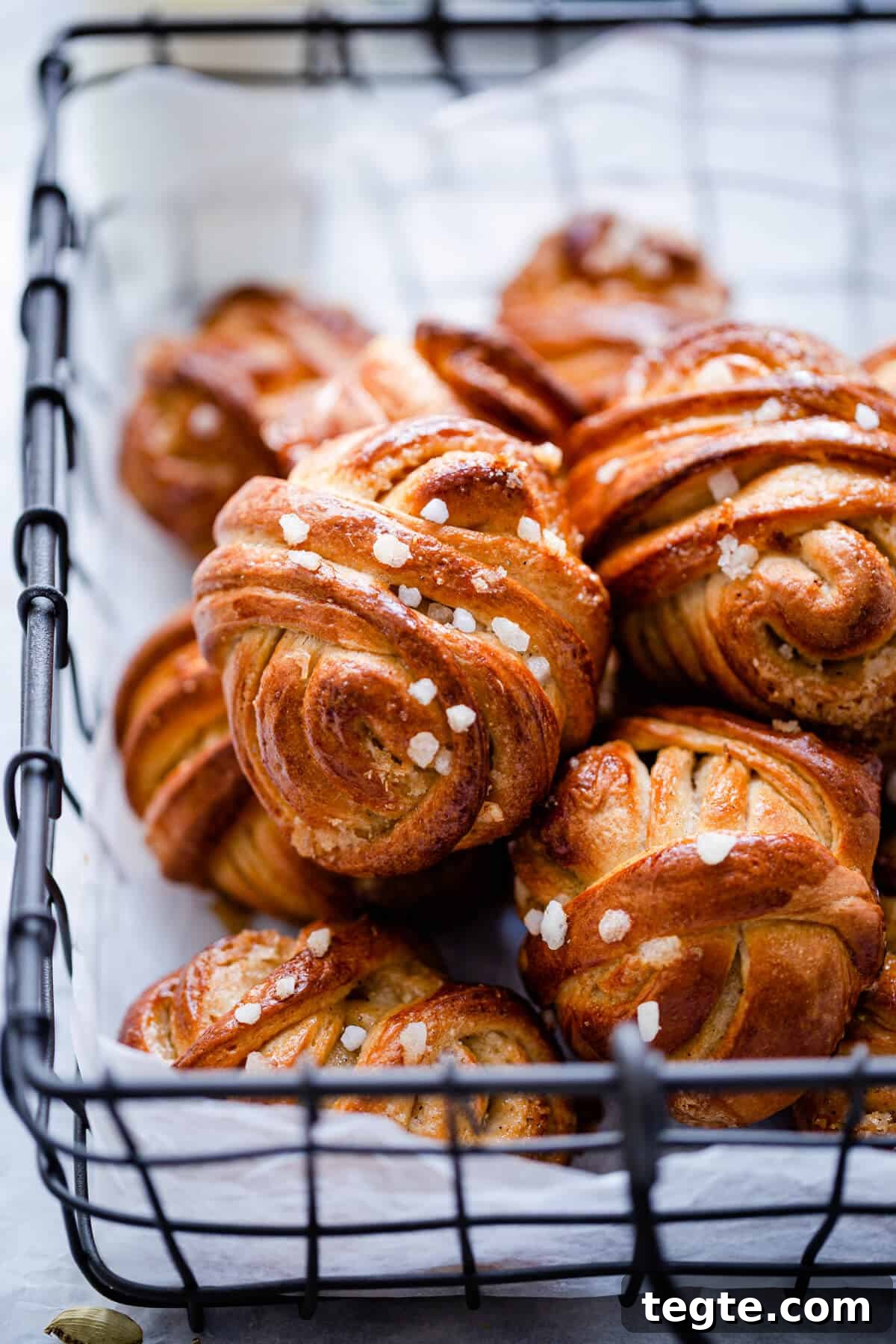 Authentic Swedish Cardamom Buns (Kardemummabullar) Recipe 4 side close up of buns with sugar pearls