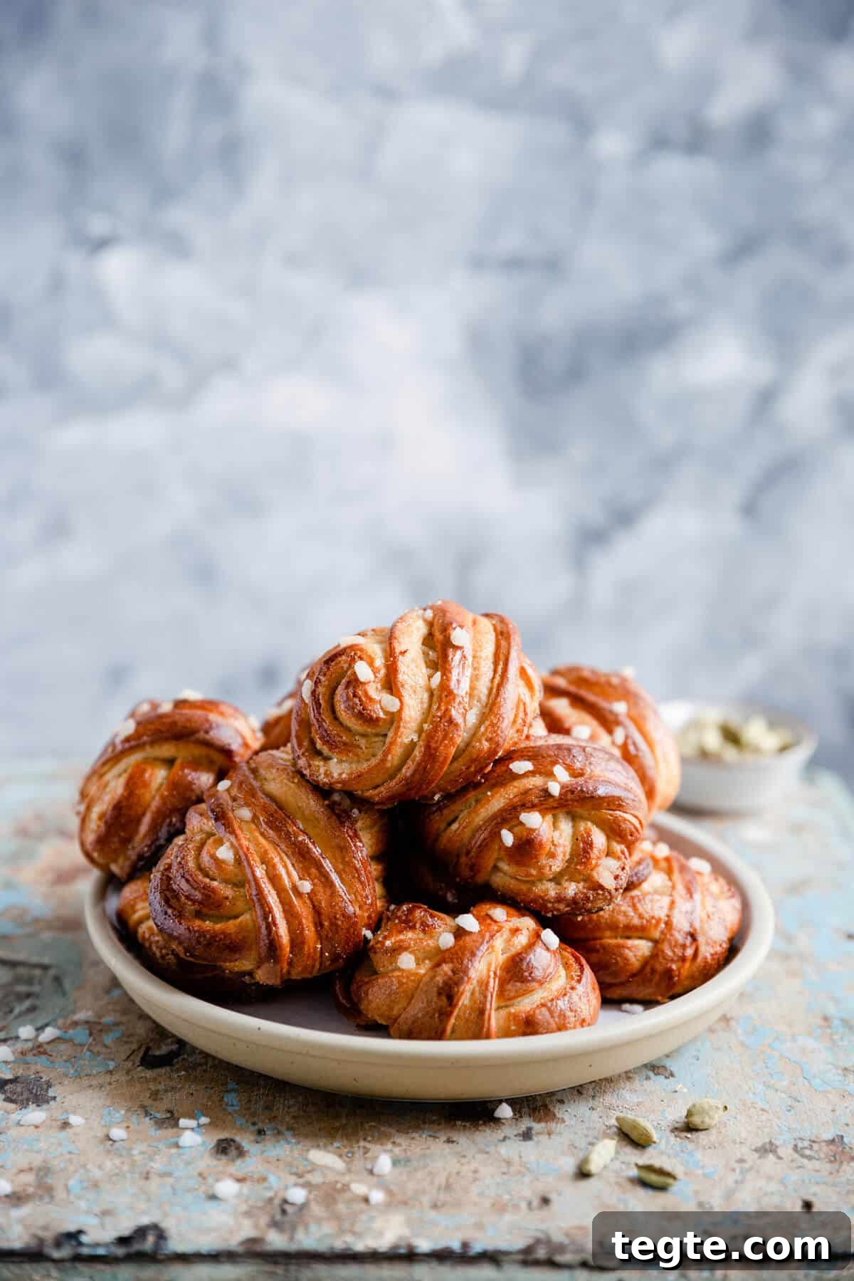 Authentic Swedish Cardamom Buns (Kardemummabullar) Recipe 5 side shot of a plate with cardamom buns