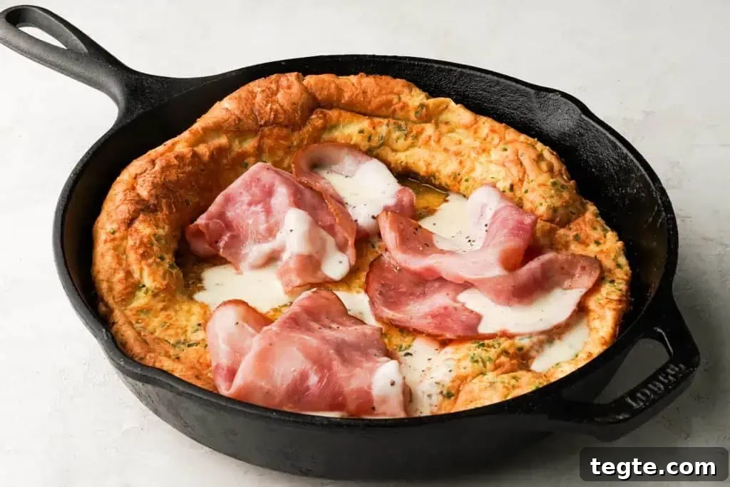 savory dutch baby for two savory dutch baby with ham and bechamel sauce in a skillet