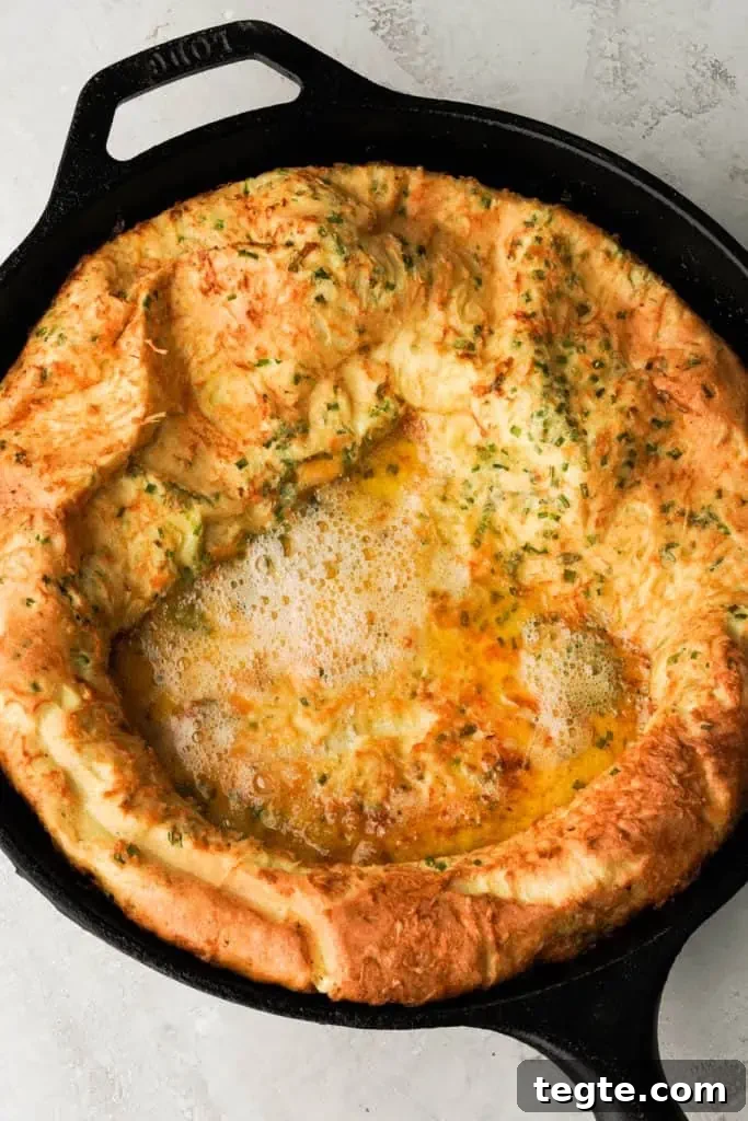 what is a savory dutch baby cooked dutch baby in a cast iron skillet.