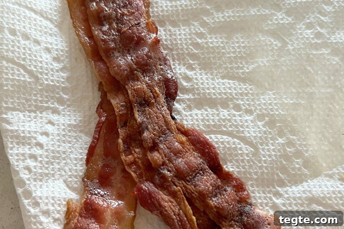 Hearty Country Breakfast Bowl Recipe for Morning Energy 4 Cooked and crisp bacon on paper towels.