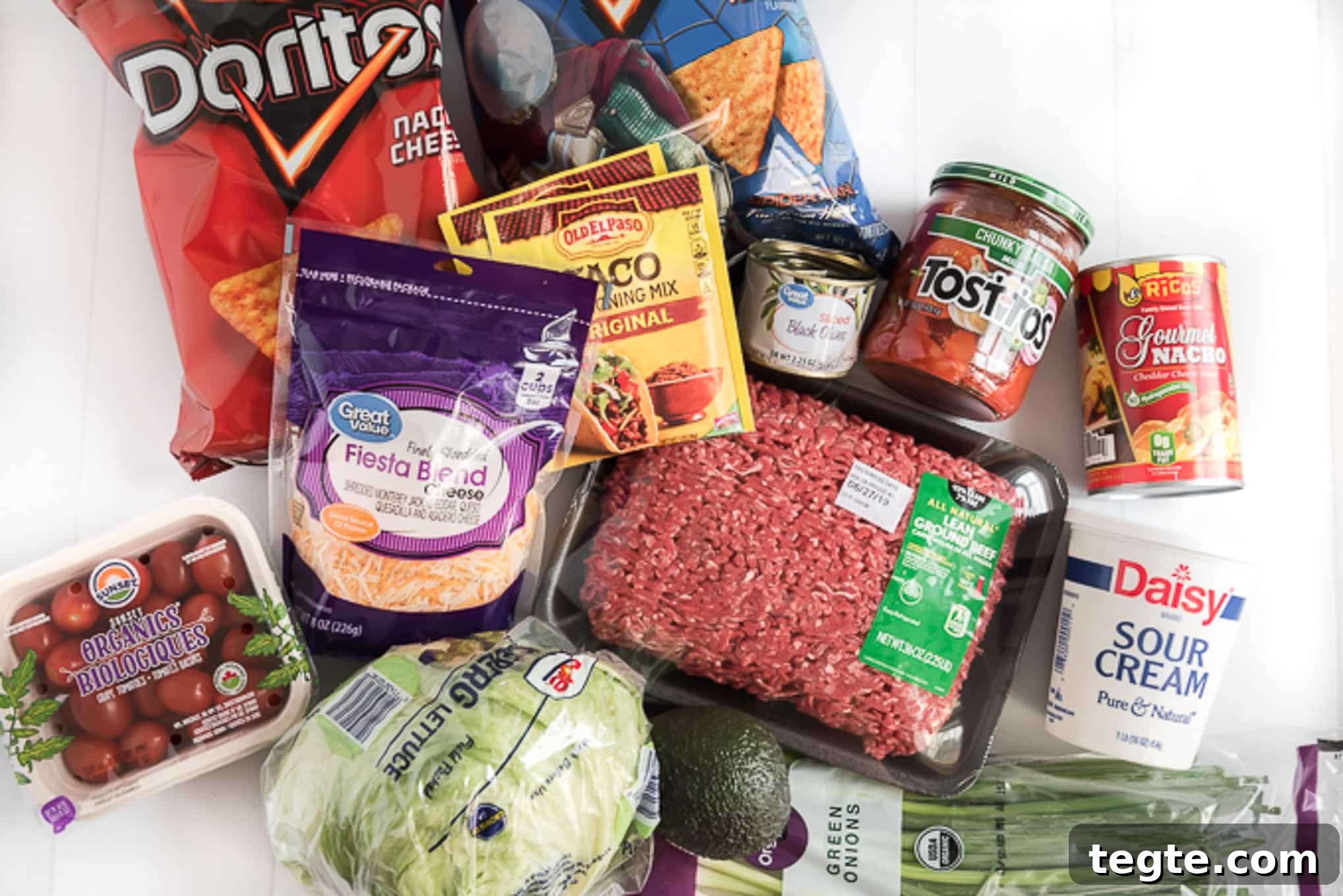 Doritos Taco Casserole: Cheesy Tex-Mex Bake Everyone Loves 3 Gathered ingredients for Taco Casserole with Doritos.