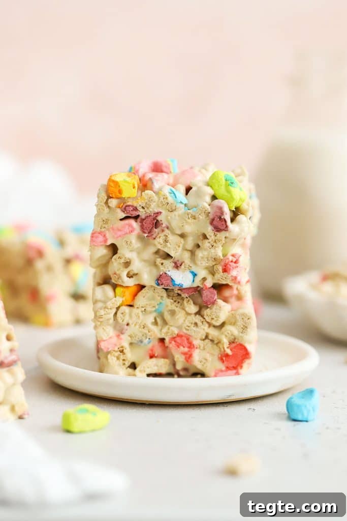Gluten-Free Scotcheroos Recipe: Chewy No-Bake Chocolate Peanut Bars 10 Lucky charms treats stacked on a white plate