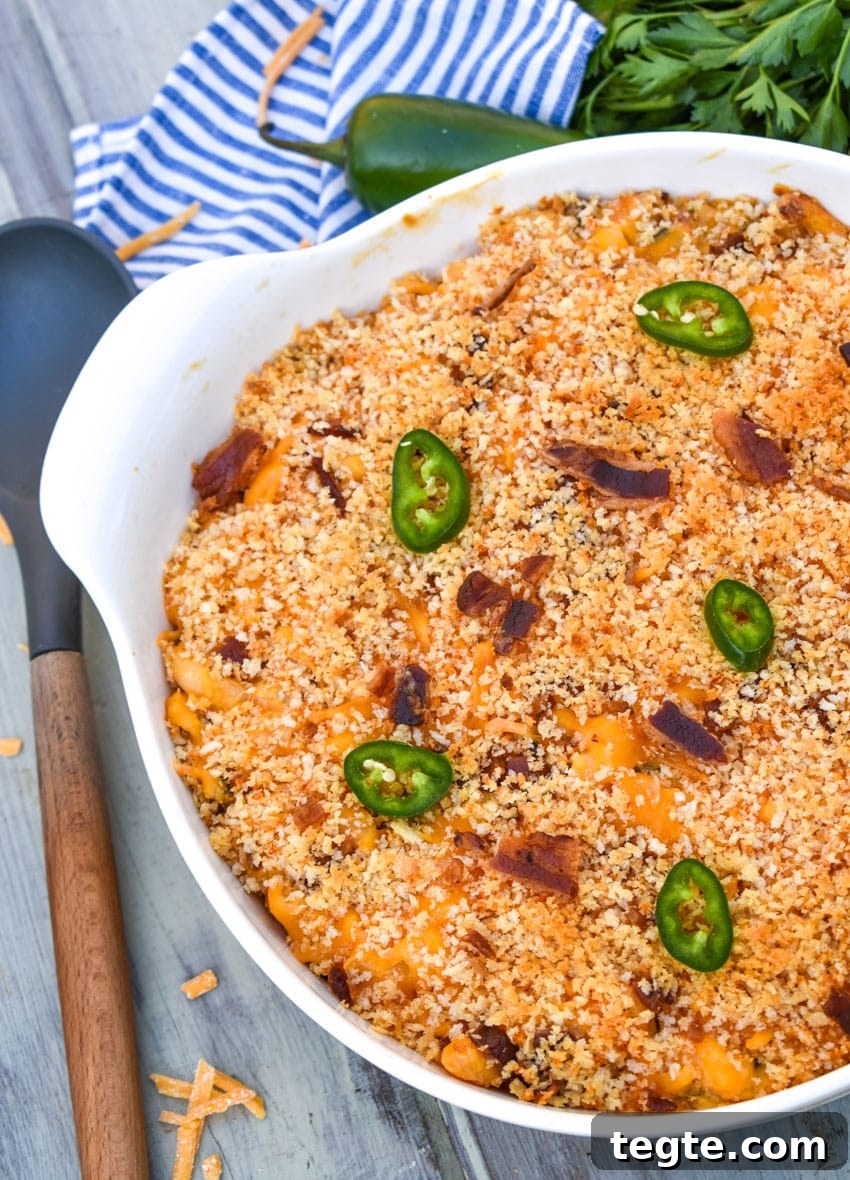 jalapeno popper mac and cheese in a large white serving bowl