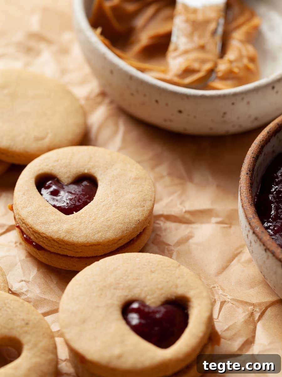 Gluten-Free Peanut Butter & Jelly Cookies Recipe 9 Peanut Butter and Jelly Cookies filled with peanut butter and raspberry jam