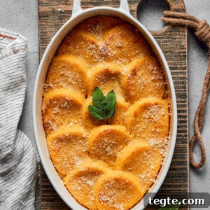 Baked gnocchi alla Romana garnished with fresh sage.