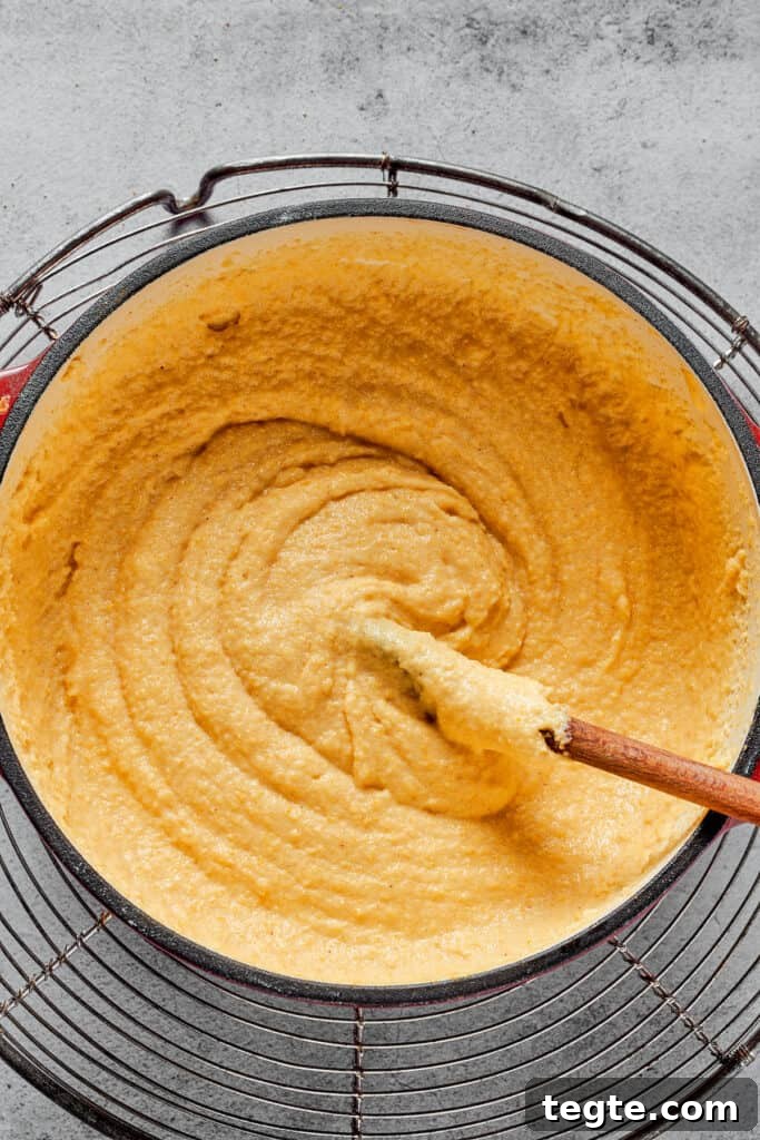 A Dutch oven filled with thick semolina batter.