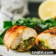 The easiest, moistest, most flavorful chicken ever! This bacon wrapped pesto chicken is packed with flavor and takes only 15 minutes to bake under the broiler. making it a perfect weeknight meal!