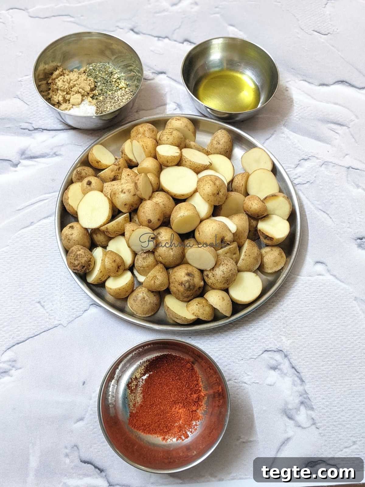 Ingredients for making air fryer Greek potatoes: potatoes, seasoning, olive oil and lemon juice