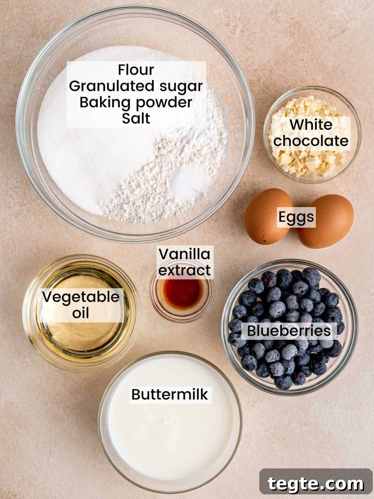 Ingredients needed to make blueberry muffins with white chocolate.