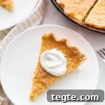 Southern Buttermilk Pie Recipe — Quick 30-Minute Dessert 7 buttermilk pie plated with pie plate in background