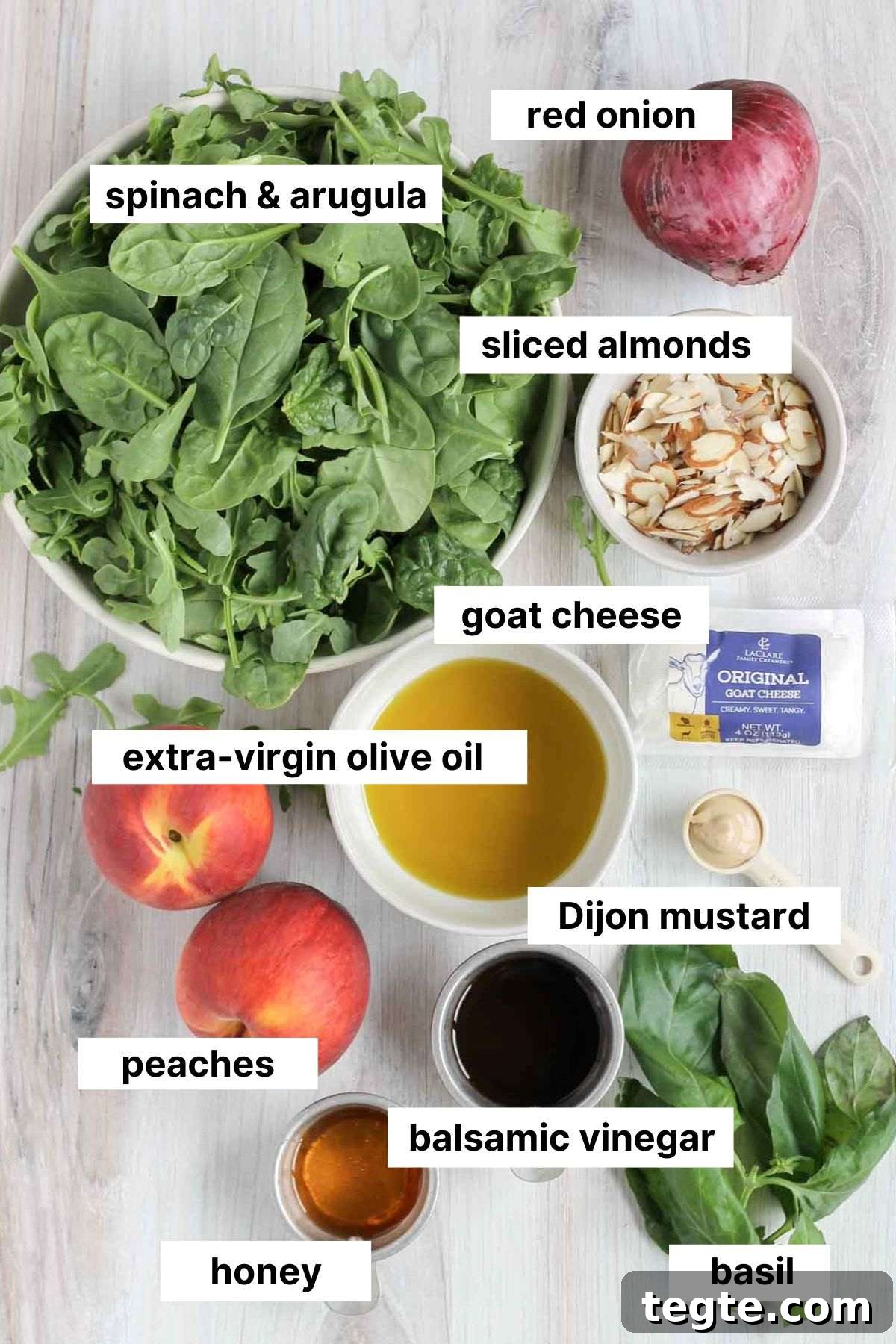 Labeled ingredients for peach and goat cheese salad.