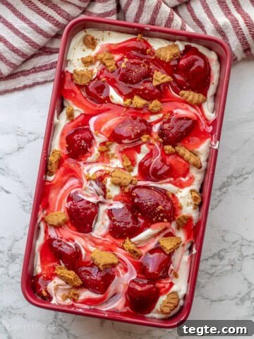 Strawberry cheesecake ice cream in a pan.
