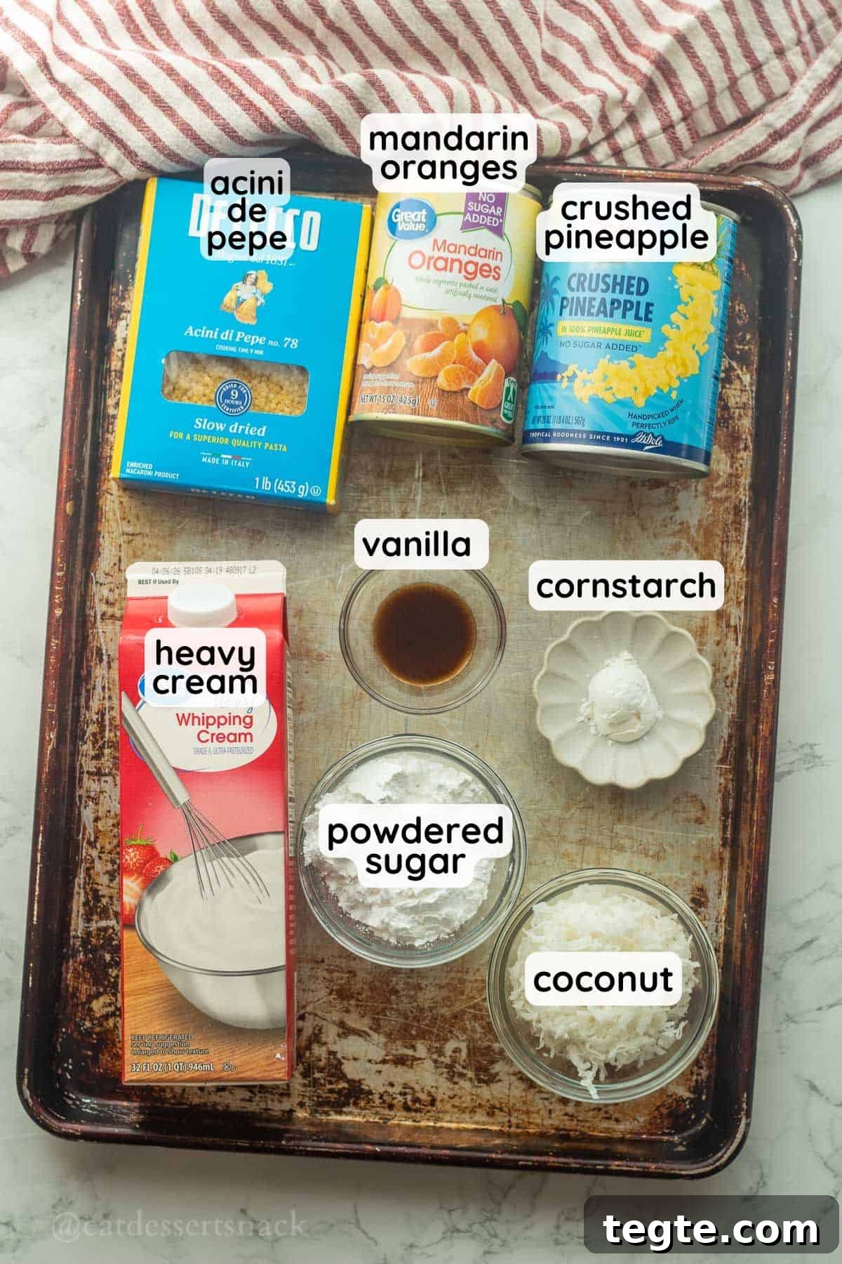Labeled ingredients for frog eye salad on metal tray.