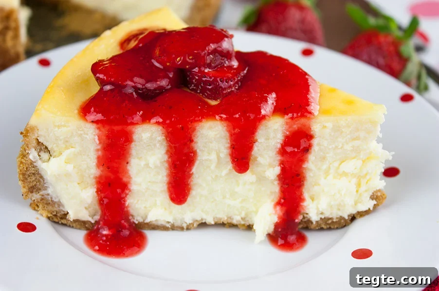 Silky Strawberry-Topped Cheesecake Recipe for Creamy Perfection 2 Smooth and Creamy Cheesecake with a strawberry topping.