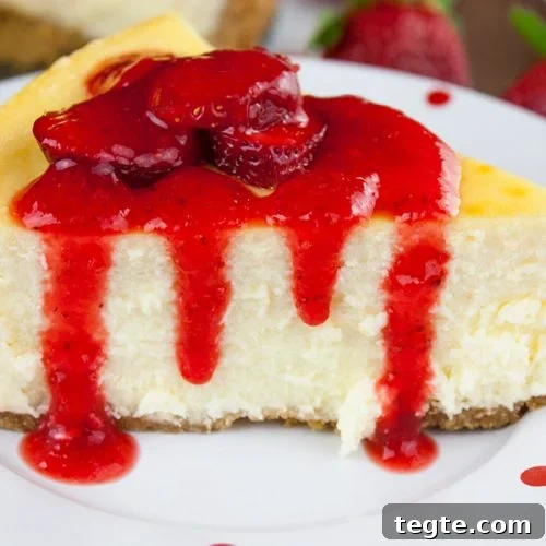 Silky Strawberry-Topped Cheesecake Recipe for Creamy Perfection 8 Smooth and Creamy Cheesecake with a strawberry topping.