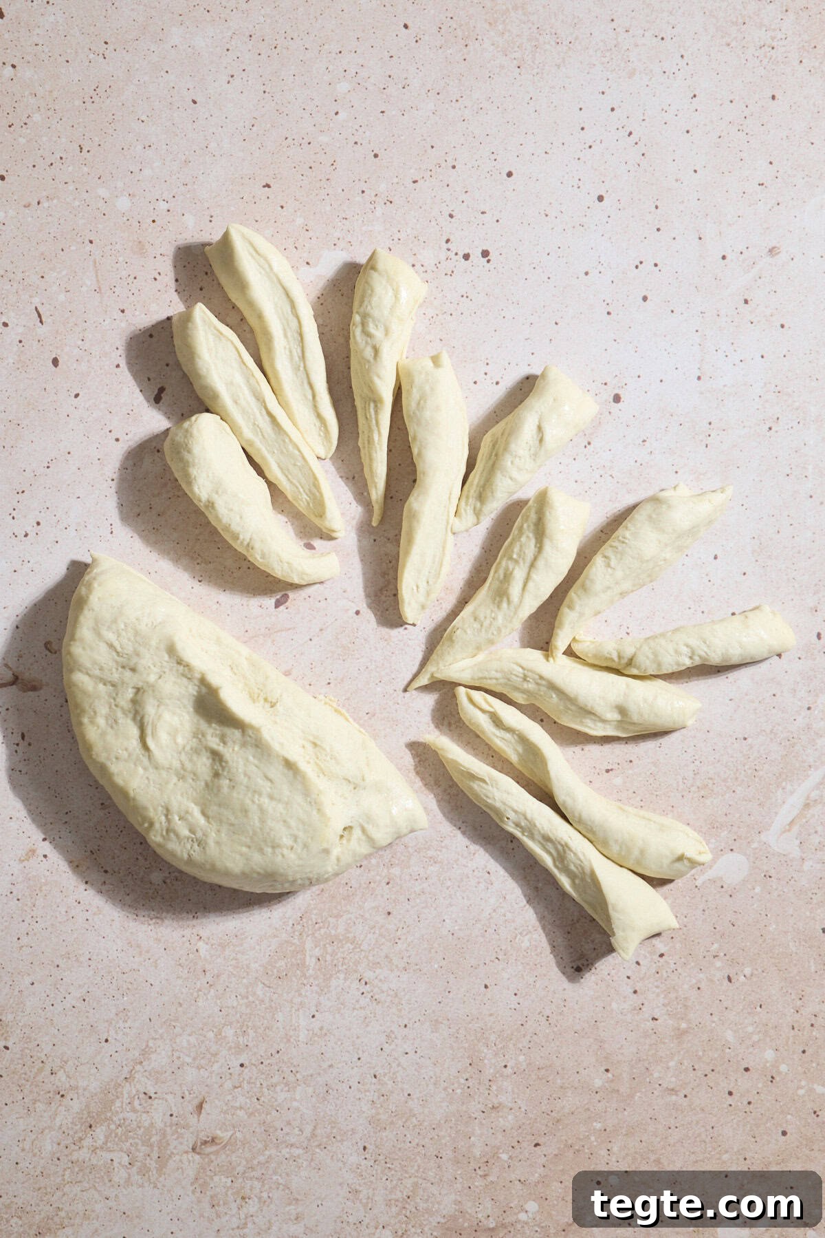 Mini Sourdough Discard Pizzas: Crispy Tiny Pizzas from Leftover Starter 6 Dough being divided into 24 pieces.
