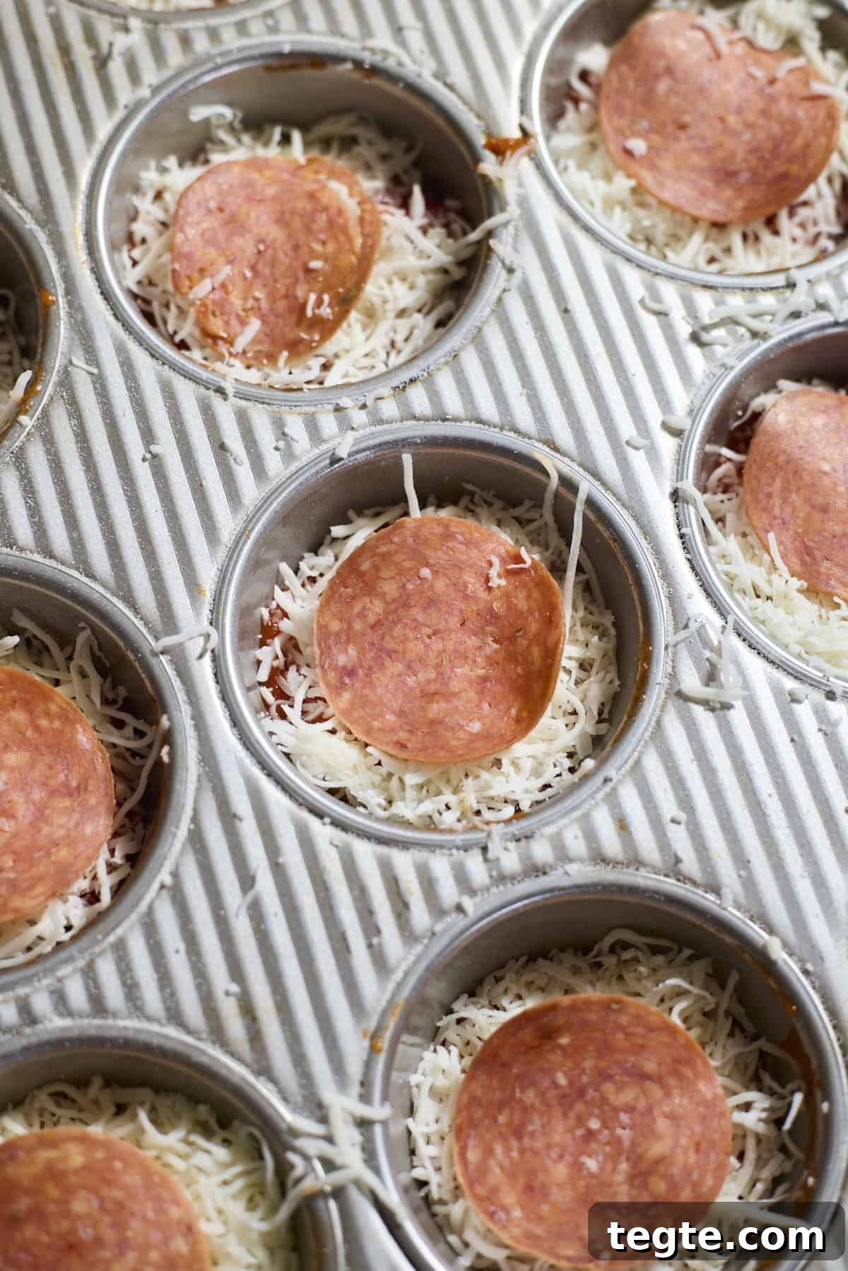 Mini Sourdough Discard Pizzas: Crispy Tiny Pizzas from Leftover Starter 8 Miniature pizzas topped with pepperoni.