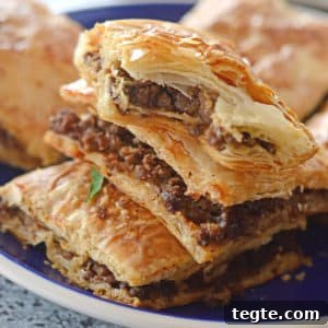 Egyptian Phyllo Meat Pie (Goulash) Recipe 6 A close up of a phyllo pie on a plate, stuffed with ground beef