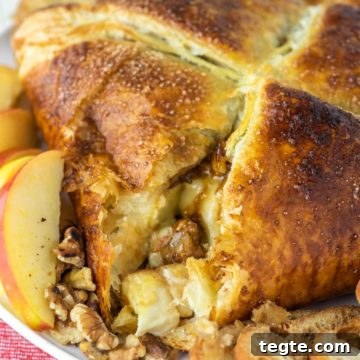 close-up of baked brie in puff pastry cut into