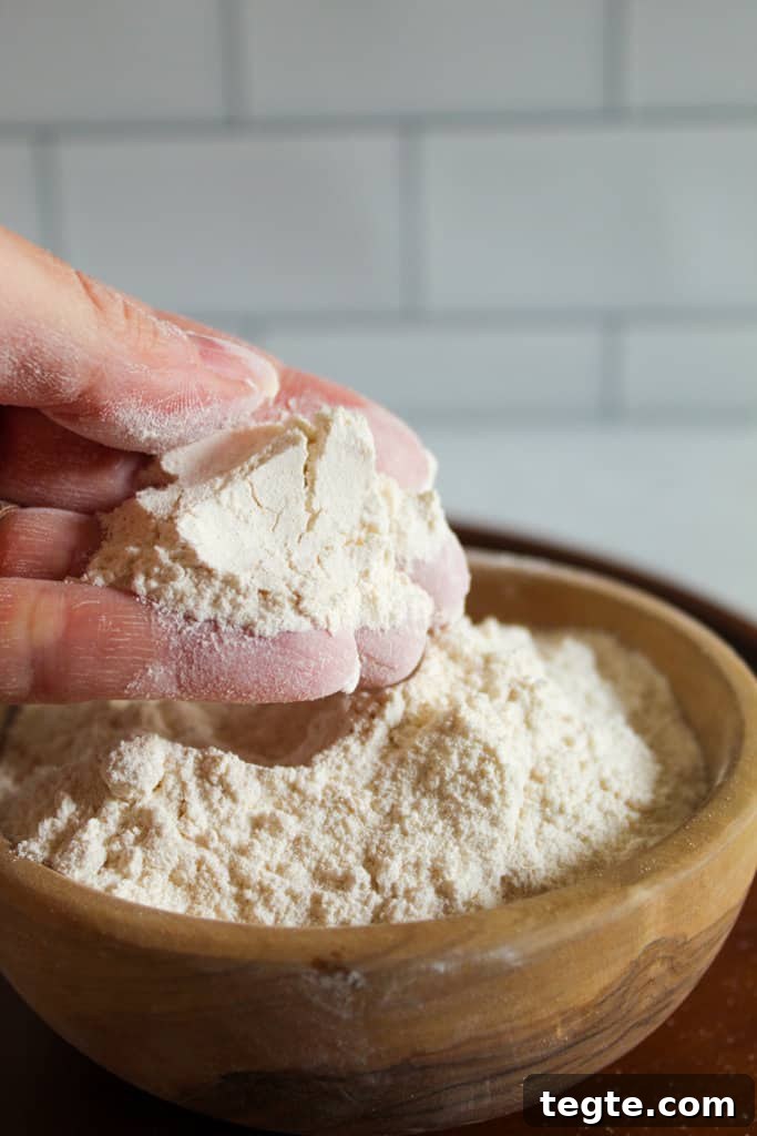 Cassava Flour vs Tapioca Starch: Key Differences and Uses 3 Cassava Flour vs. Tapioca Starch: hand holding cassava flour.