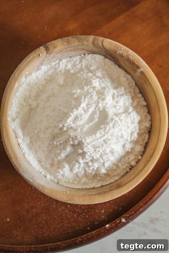 Cassava Flour vs Tapioca Starch: Key Differences and Uses 4 overhead shot of a wooden bowl of tapioca starch.