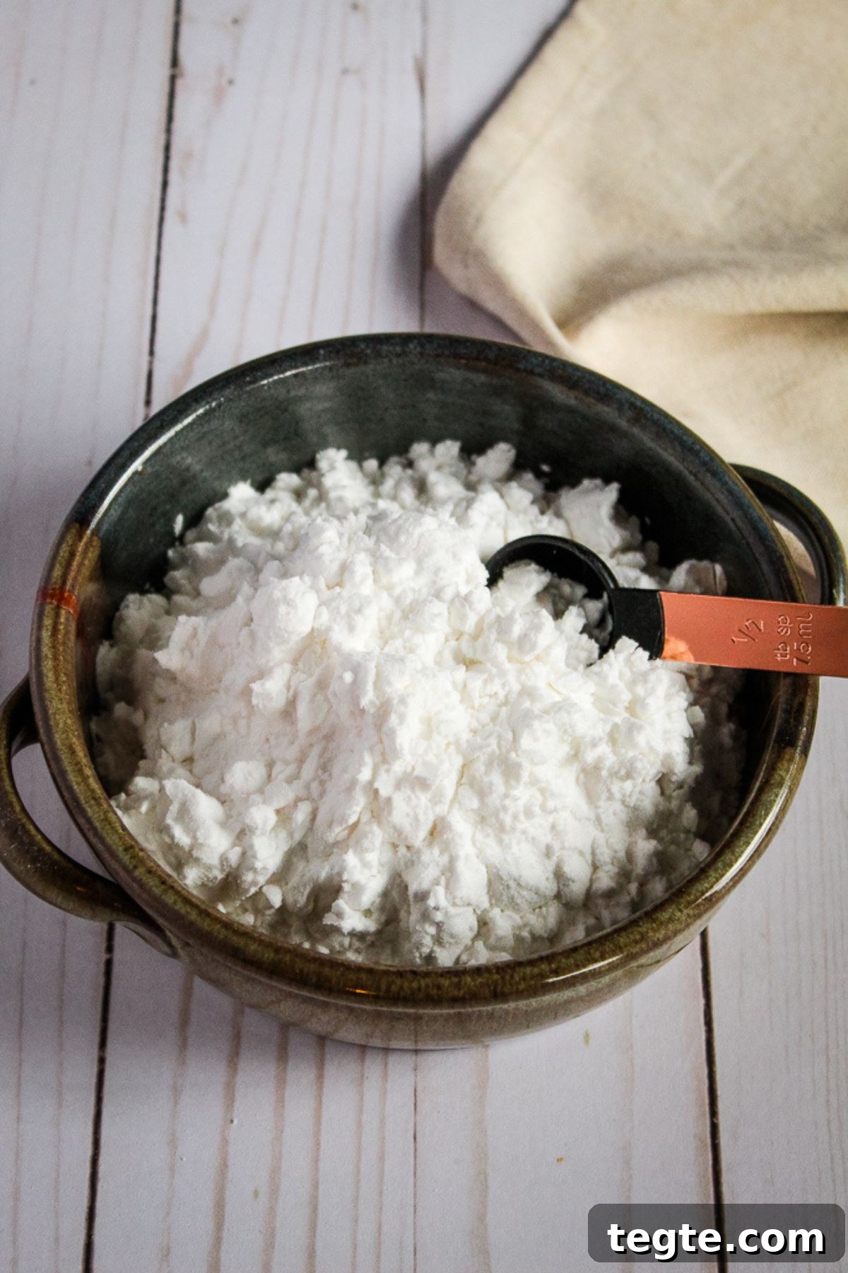 Cassava Flour vs Tapioca Starch: Key Differences and Uses 10 bowl of potato starch with a measuring spoon