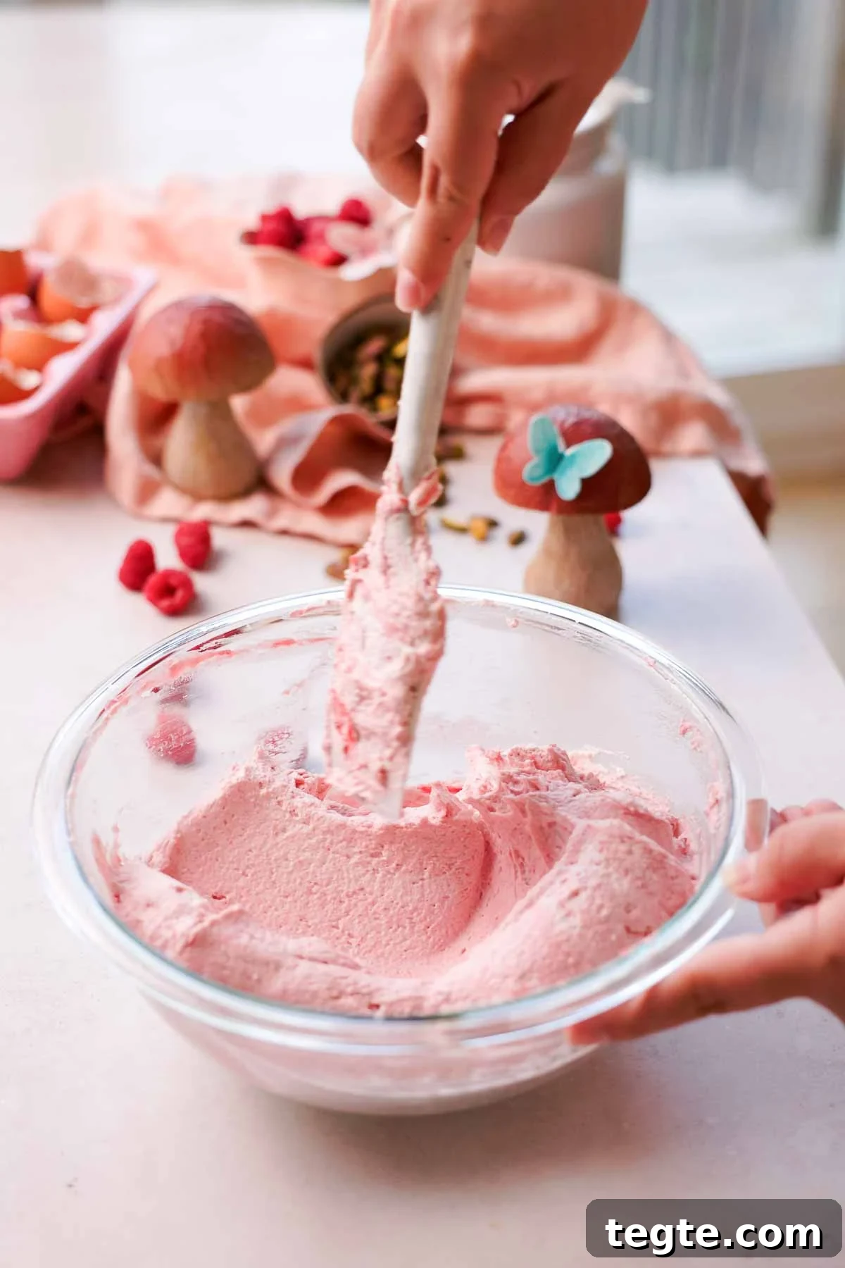 Raspberry and Pistachio Cake Roll Recipe for Spring Gatherings 12 folding raspberry whipped cream with silicone whisk