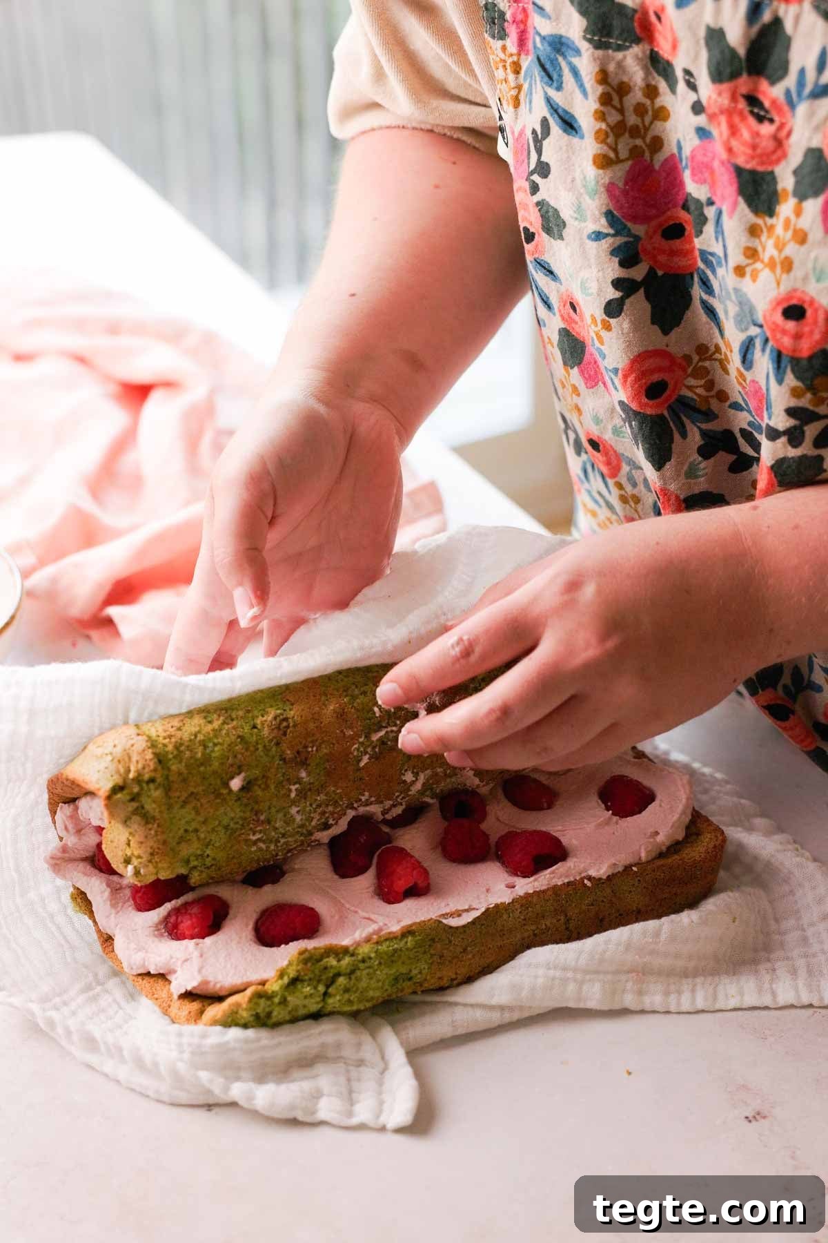 Raspberry and Pistachio Cake Roll Recipe for Spring Gatherings 14 rolling filled pistachio sponge with raspberry filling