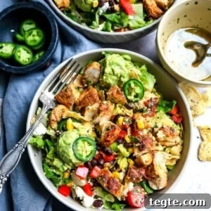 Big bowl with salad and lots of toppings.