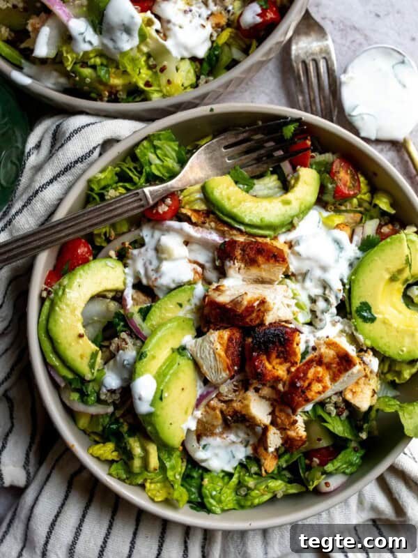 Grey bowl with salad and avocado.
