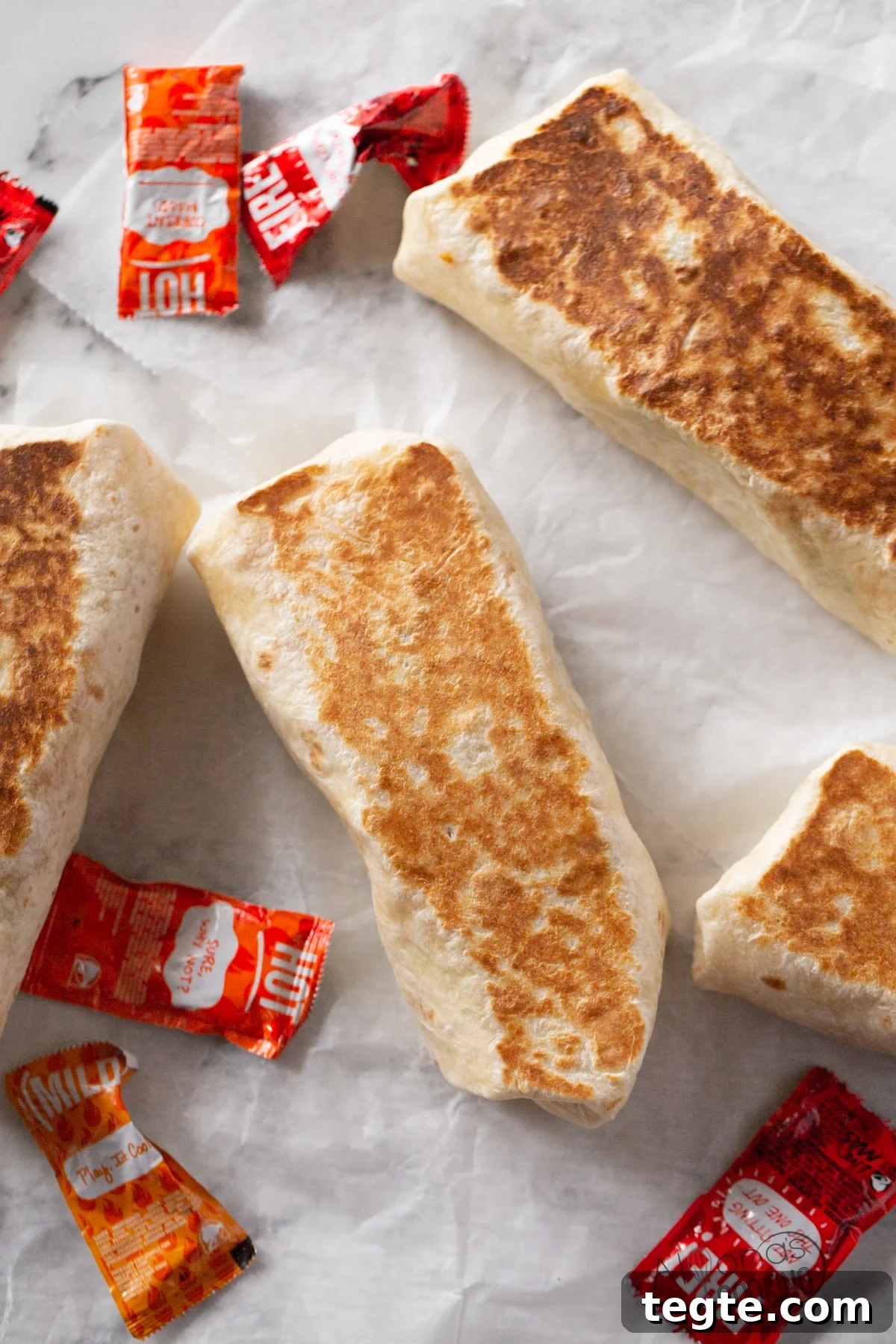 Make the Original Grilled Stuffed Burrito at home like the Burritos Taco Bell used to make back in 2005! The true Grilled Stuft Burrito with baja sauce not the later XXL Burrito. I'm bringing back my favorite Taco Bell menu item (and it's so EASY to make!) All you need is flour tortillas, rice, refried beans, pico de gallo, baja sauce, and cheese! how to make original grilled stuffed burritos like Taco Bell