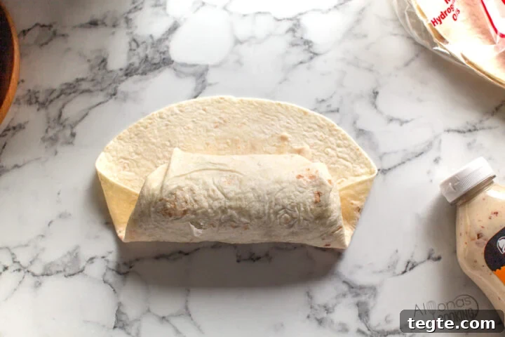 Taco Bell Grilled Stuffed Burrito Recipe (Copycat) 5 how to roll a burrito like Taco bell