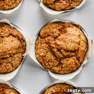 Baked pumpkin muffins in a muffin tin.