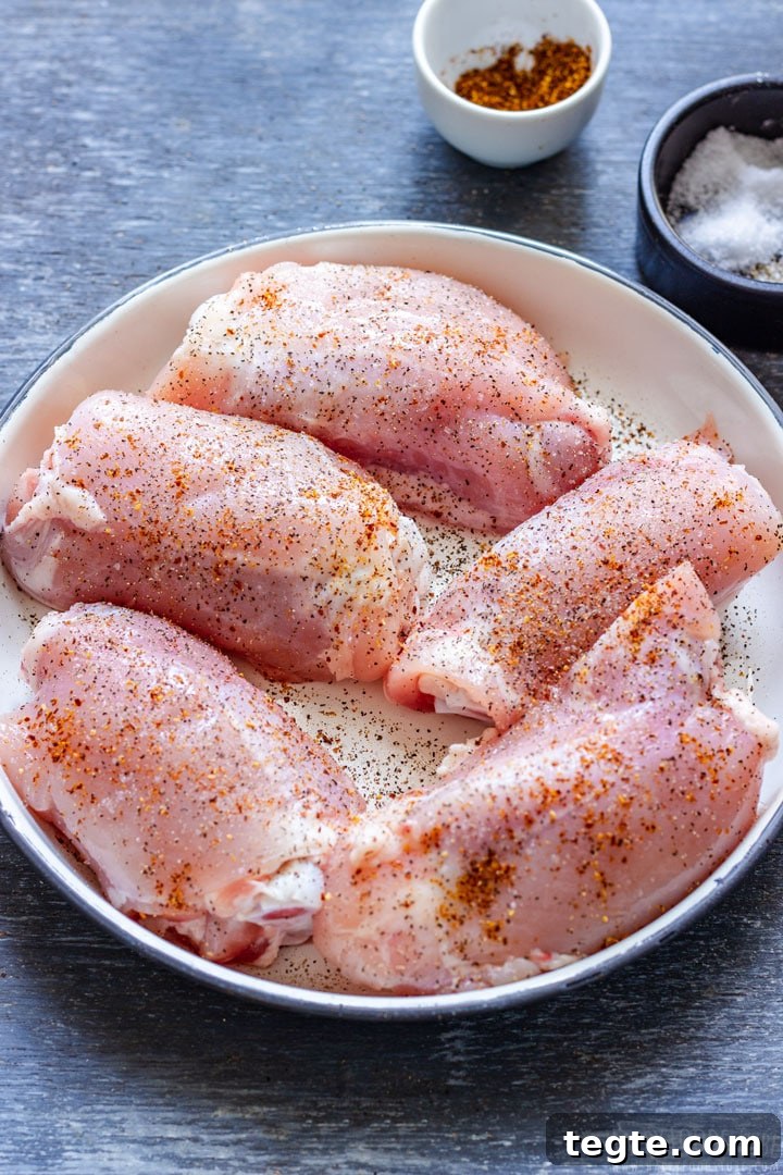 Crispy Bacon-Wrapped Chicken Thighs with Garlic Herb Glaze 3 Seasoned chicken thighs