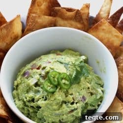 Chunky guacamole with cilantro and tomatoes