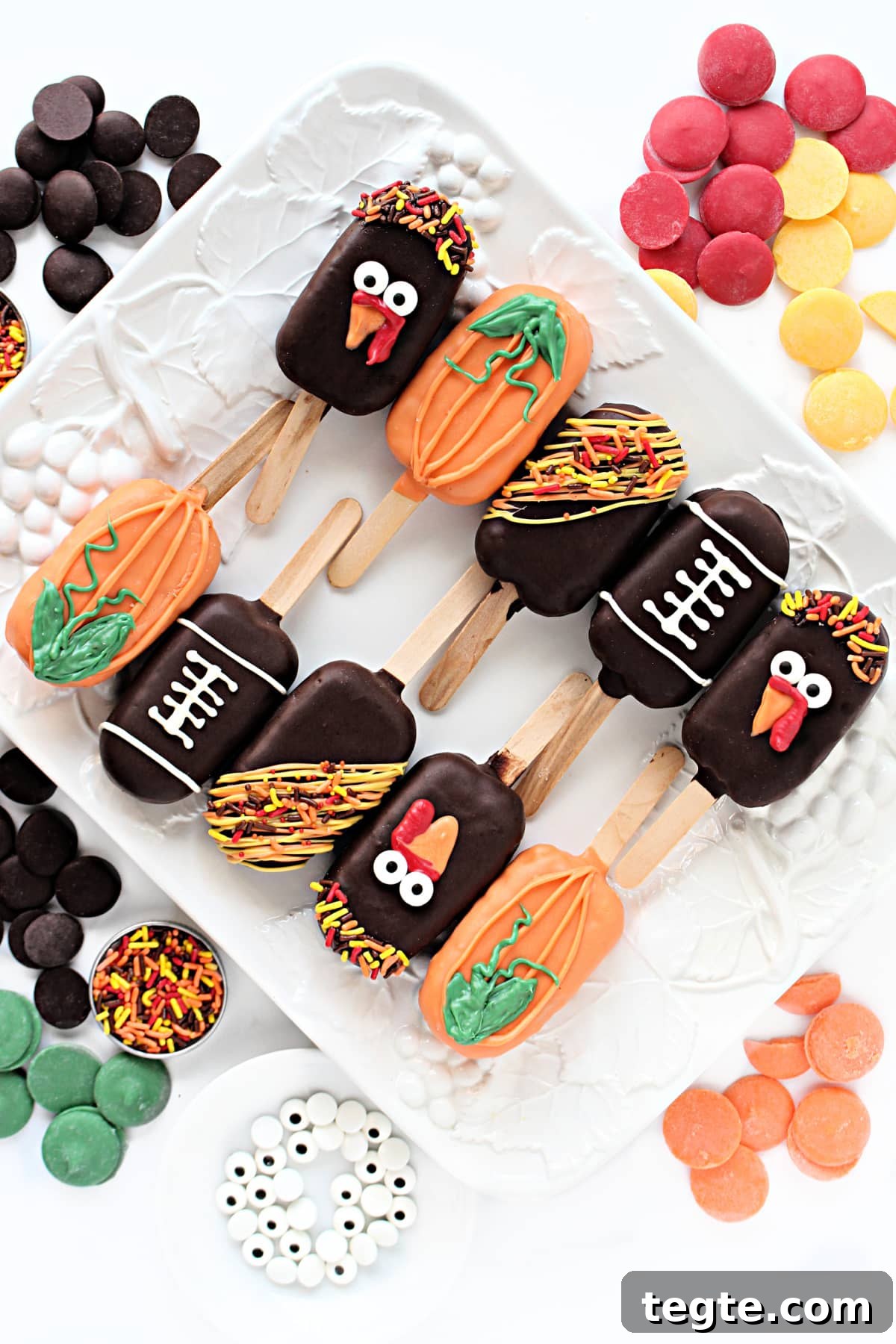 Thanksgiving Peanut Chew Candy Pops Recipe for Fall Treats 2 Chocolate coated Peanut Chews Candy Pops decorated like turkeys, pumpkins, and footballs.