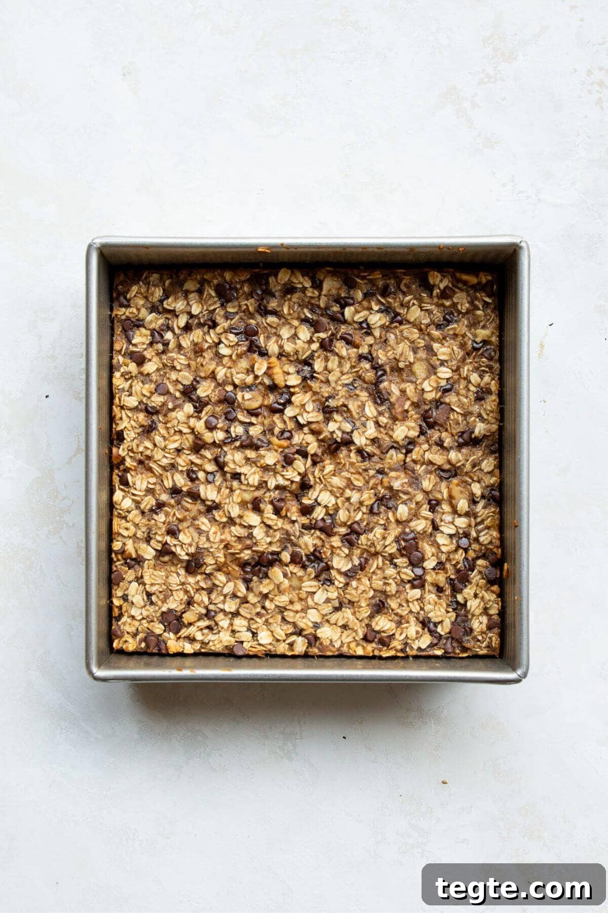 Vegan Baked Oatmeal Recipe for Busy Mornings 8 Soft and tender vegan baked oatmeal in a baking dish.