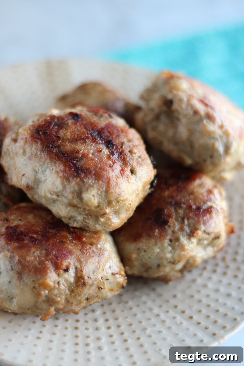 Stuffed Bacon Turkey Burgers- cheese-stuffed turkey burgers are kicked up with bacon, caramelized onions, and avocado dressing! Paleo, GF, DF | fedandfulfilled